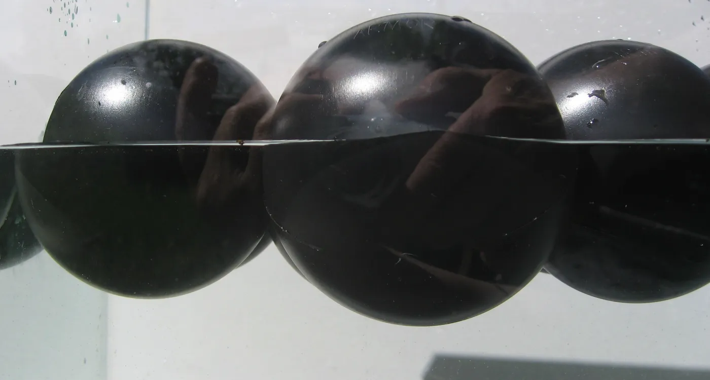 Close-up of a water-filled Armor Ball AQUA sphere showing the internal water ballast that resists wind