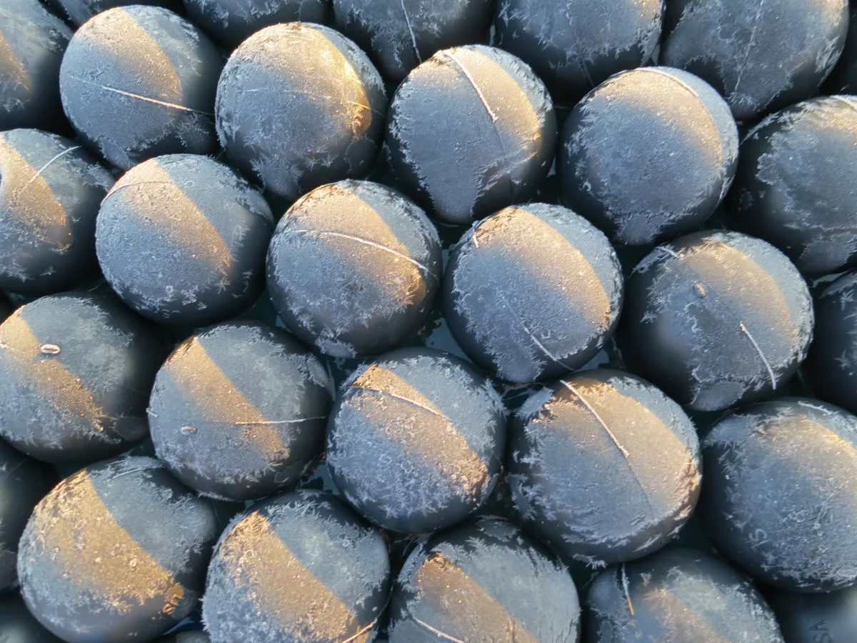 Frost-covered Armor Ball spheres demonstrating cold-weather performance down to minus 70 degrees Fahrenheit