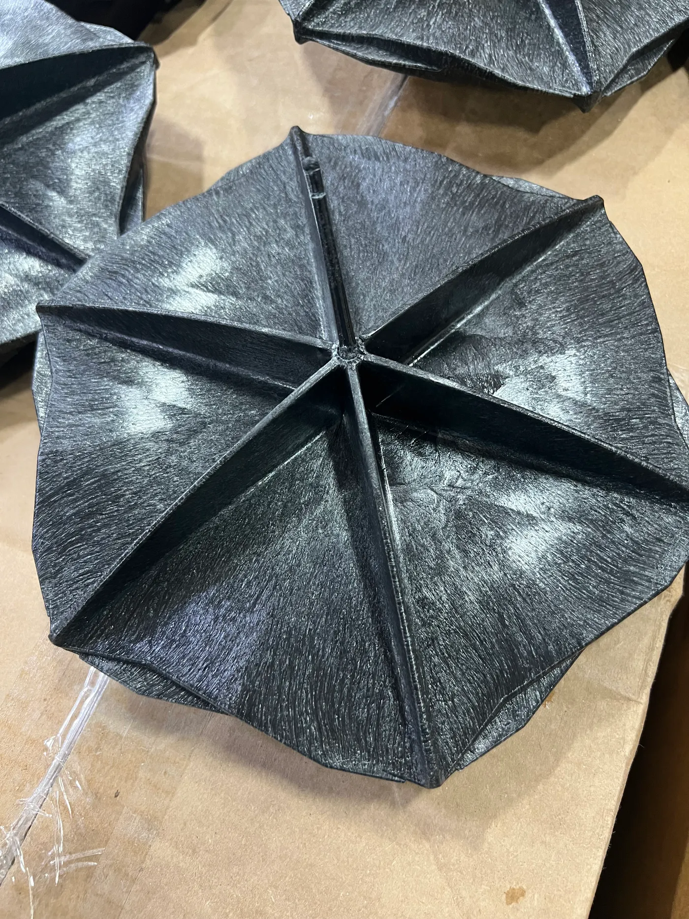 Top view of a Hexprotect SLIM composite floating cover tile showing its textured fiber surface
