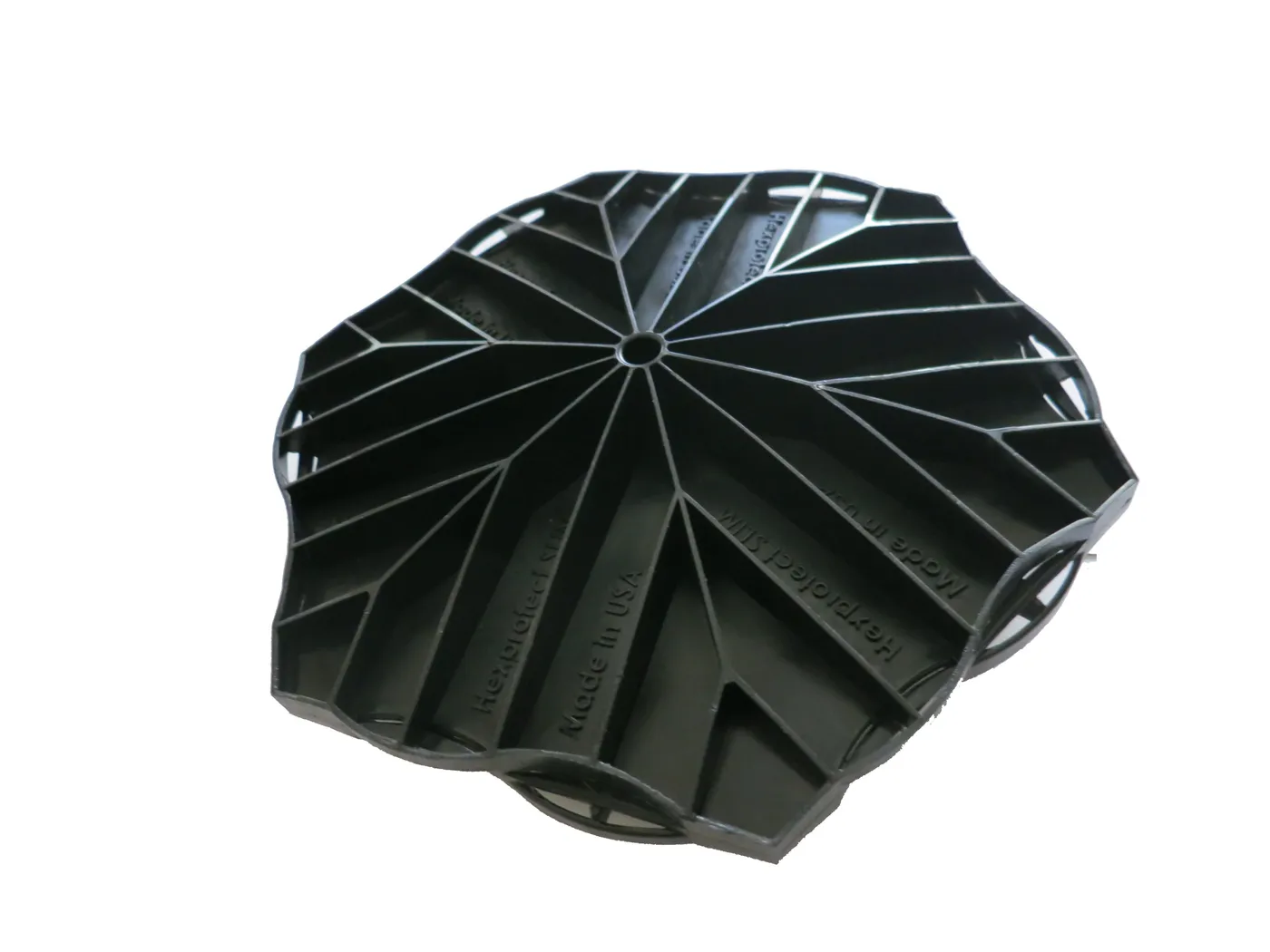 Studio photo of the octagonal ribbed Hexprotect SLIM low-profile floating cover tile