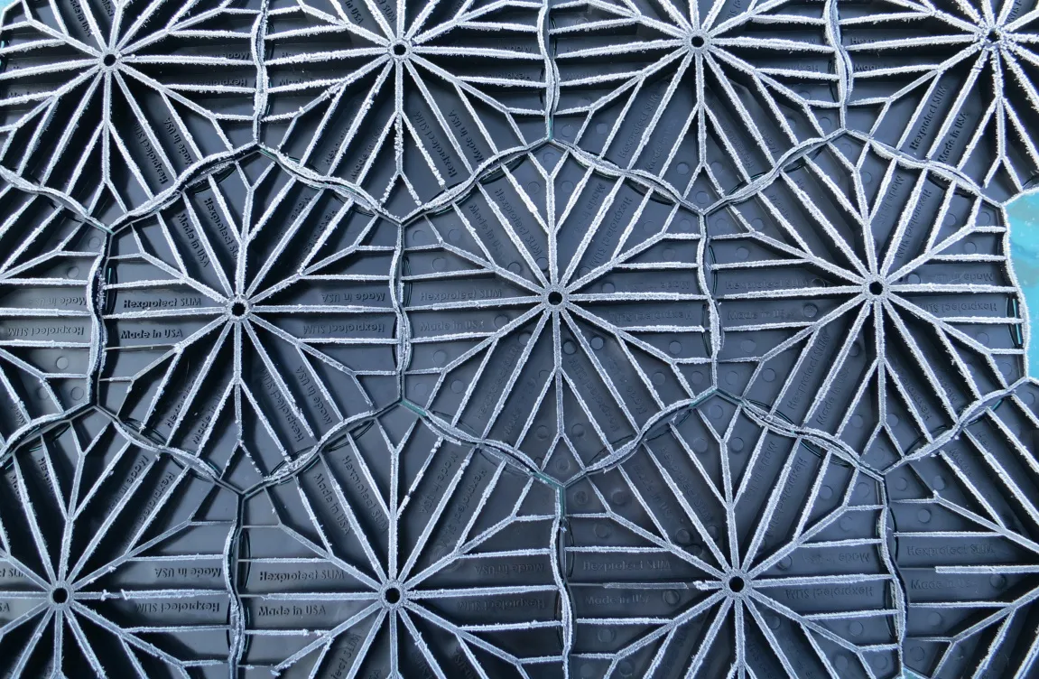 Underside star-rib pattern of interlocked Hexprotect SLIM floating tiles