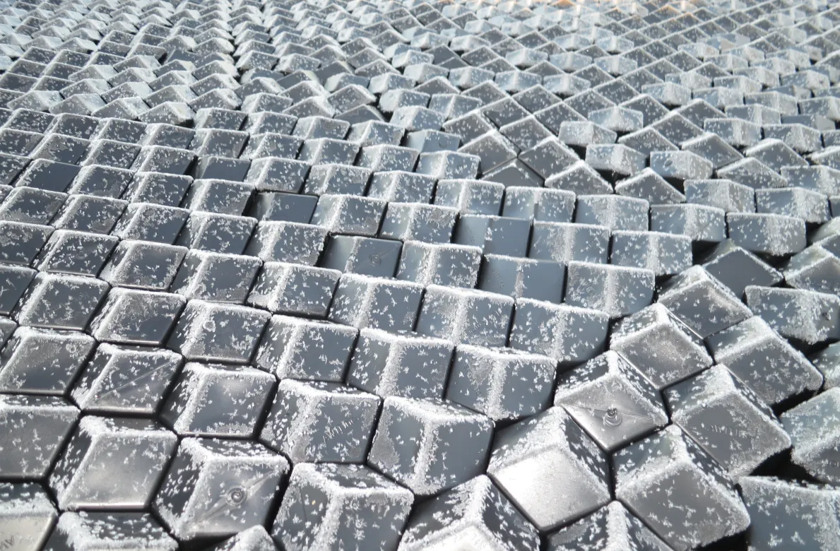 Frost-covered Rhombo Hexoshield tiles demonstrating cold-weather durability